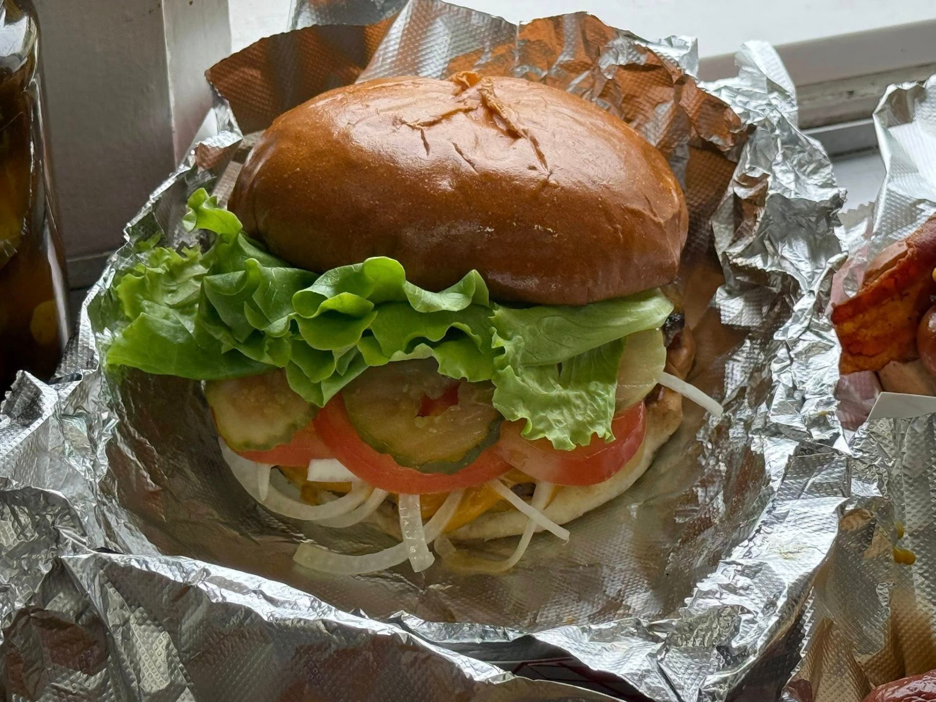 Half-pound steakhouse-blend Zippity Do Dog burger on a locally baked brioche bun